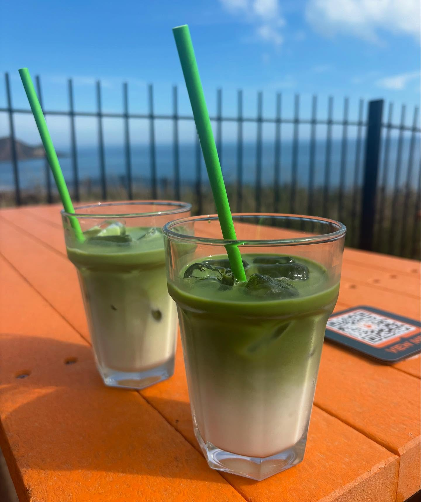 Iced matcha drinks on the deck overlooking the sea