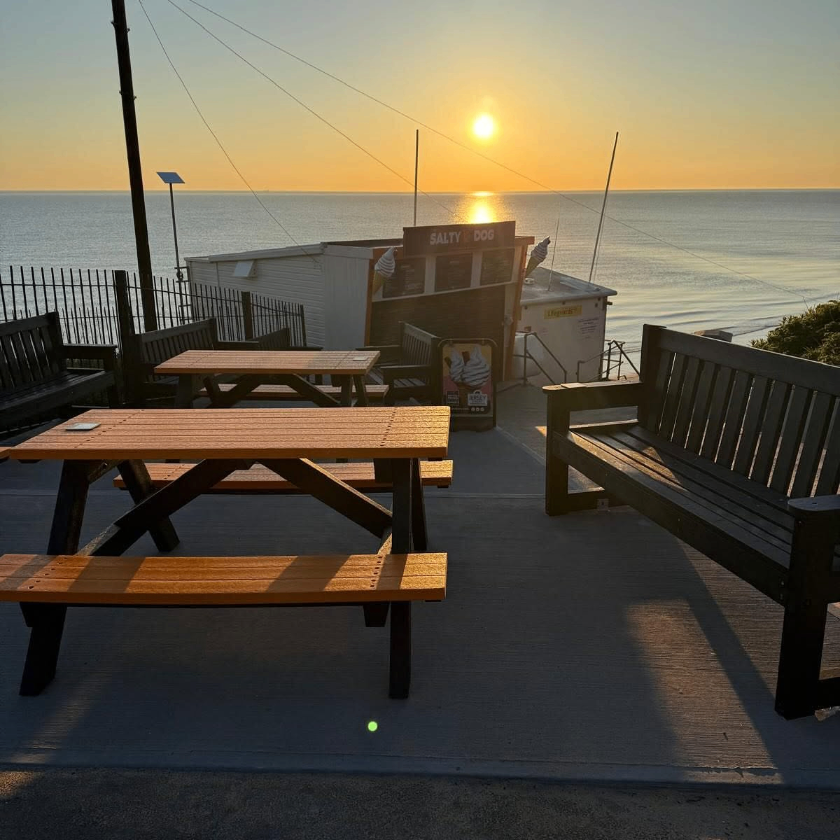 Sunset over the seating area outside The Salty Dog